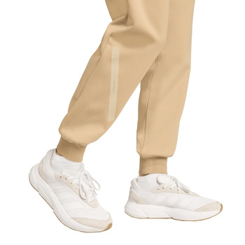 Spodnie dresowe damskie adidas Z.N.E. beżowe JW7739